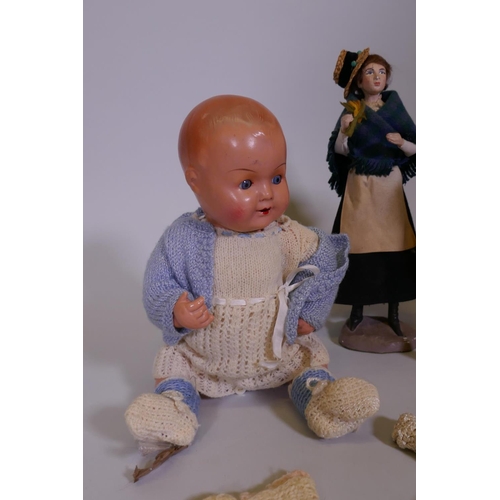 9 - A K&B celluloid head doll, with rolling eyes, marked 1728/4, another, unmarked and a hand painte... 