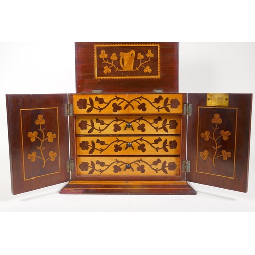 1 - A C19th Killarney ware inlaid table cabinet with lift up top and two doors opening to reveal three d... 