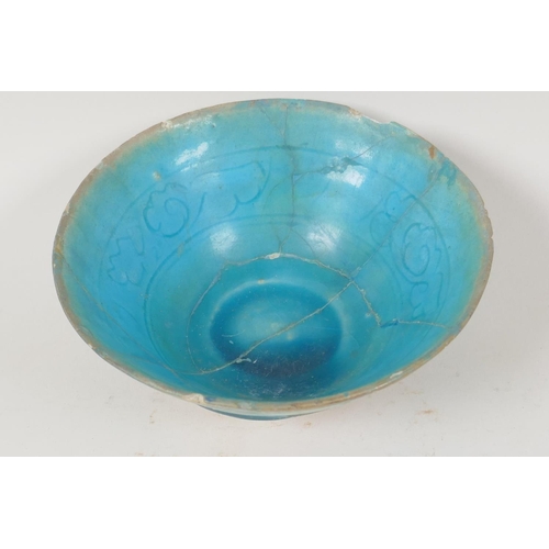 31 - An Islamic pottery conical bowl with scrafito decoration and turquoise blue glaze, 6