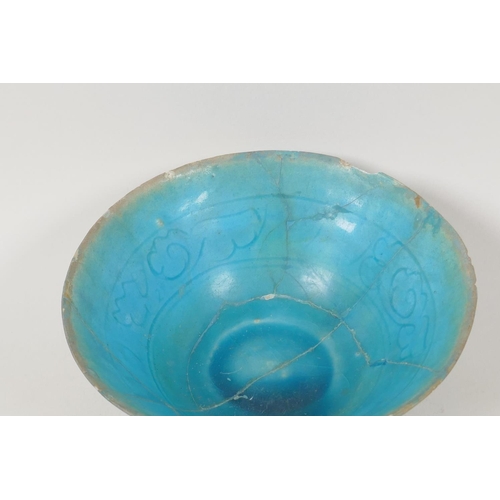 31 - An Islamic pottery conical bowl with scrafito decoration and turquoise blue glaze, 6