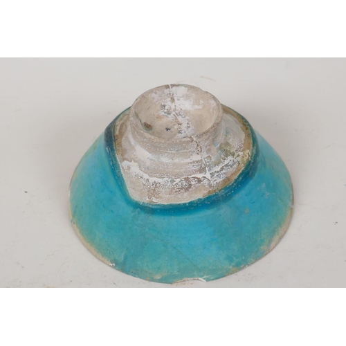 31 - An Islamic pottery conical bowl with scrafito decoration and turquoise blue glaze, 6