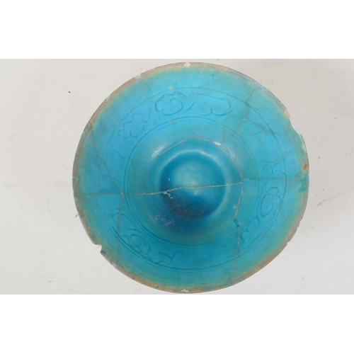 31 - An Islamic pottery conical bowl with scrafito decoration and turquoise blue glaze, 6