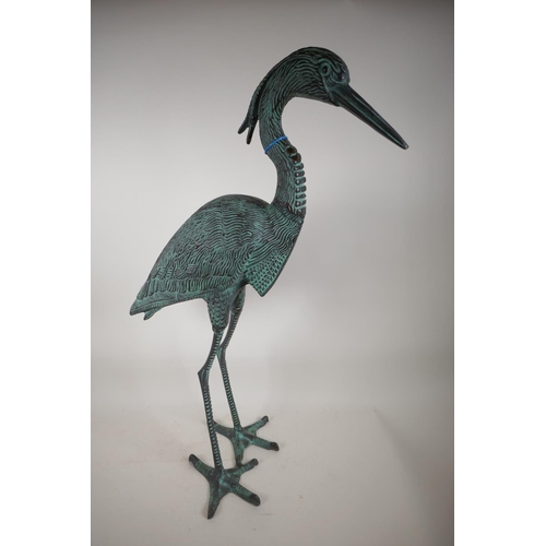 32 - A verdigris metal garden figure of a heron, 33