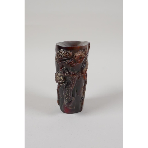 33 - A Chinese carved horn libation cup, decorated with figures beneath trees, inscribed 4 character mark... 