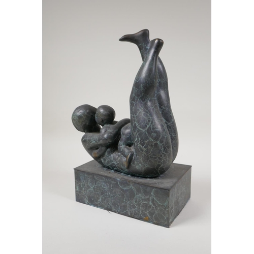 34 - A modernist patinated bronze figure of a mother and child embracing, 12½