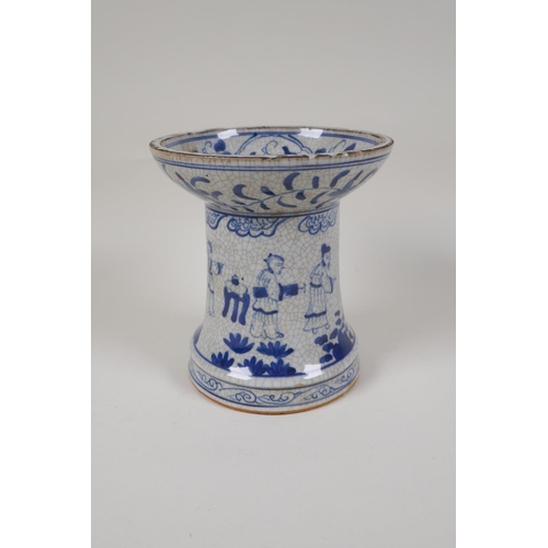 38 - A Chinese crackleware censer/taper holder with blue and white decoration of figures in a garden, 4 c... 