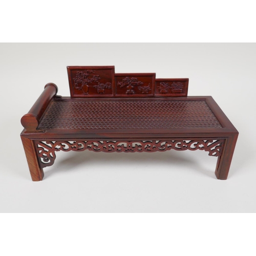 43 - A Chinese carved hardwood miniature day bed, 9