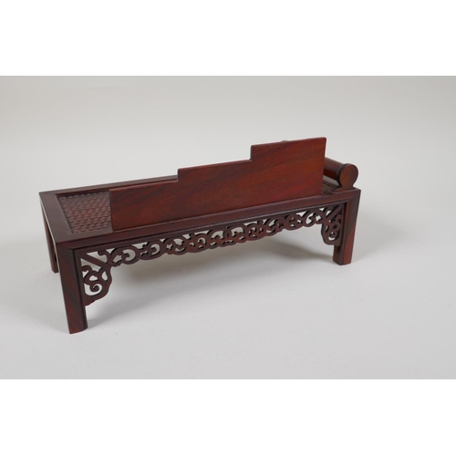 43 - A Chinese carved hardwood miniature day bed, 9