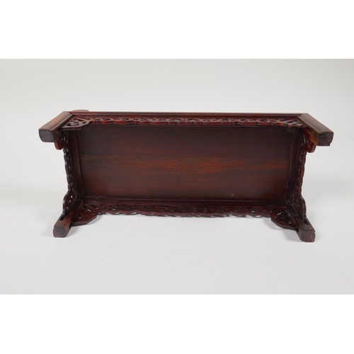 43 - A Chinese carved hardwood miniature day bed, 9