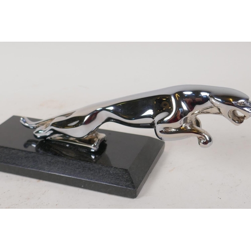 46 - A replica chrome plated Jaguar car mascot, on marble base, 9