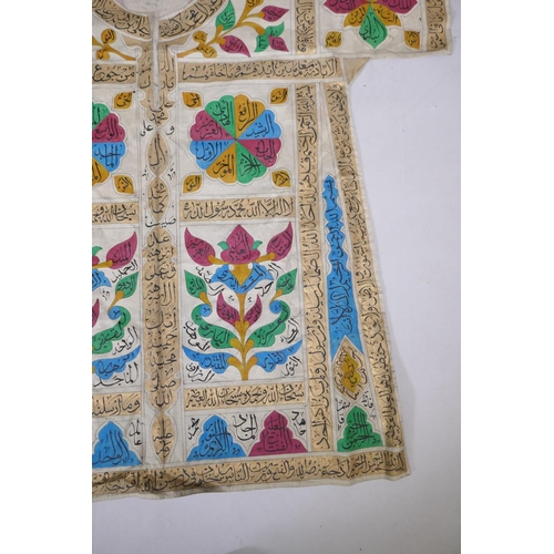 56 - An Islamic linen robe with all over hand painted calligraphy decoration 41