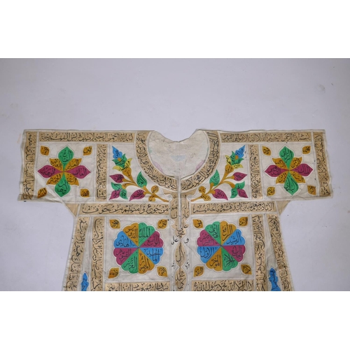 56 - An Islamic linen robe with all over hand painted calligraphy decoration 41