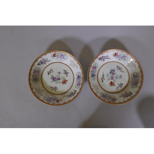 7 - A pair of Chinese export armorial tea cups and saucers, late C18th/early C19th, saucer 5