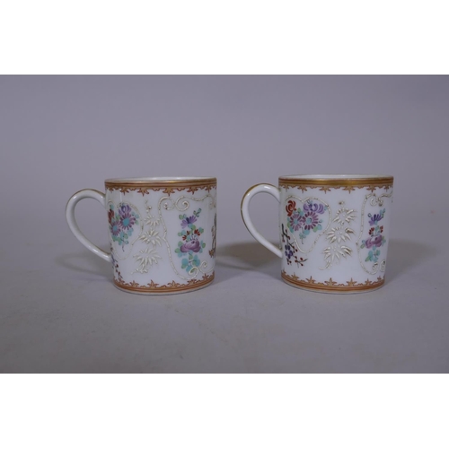 7 - A pair of Chinese export armorial tea cups and saucers, late C18th/early C19th, saucer 5