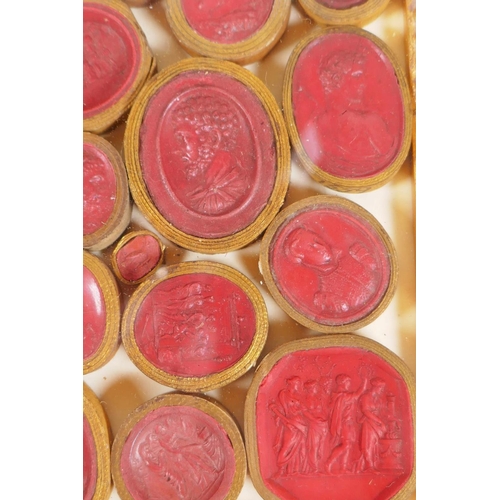 1 - A framed collection of Grand Tour red wax intaglios depicting classical figures, each individually w... 