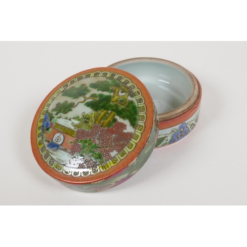 10 - A famille vert porcelain cylinder box and cover, decorated with a landscape scene, dragons and the f... 