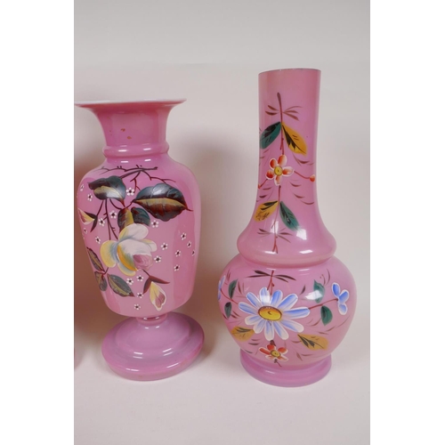 12 - A pair of C19th pink milk glass vases, painted with flowers, 12½