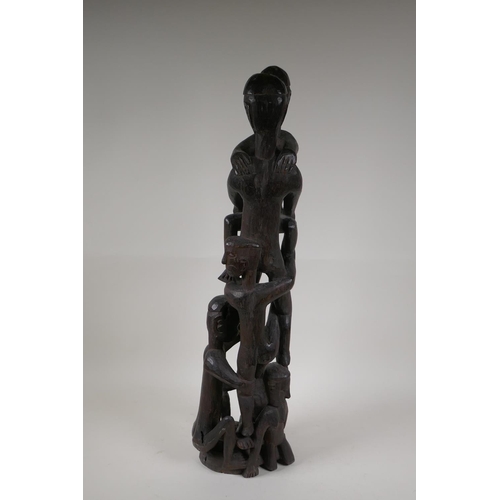 21 - A Philippino Ifugao carved hardwood figure group, 26