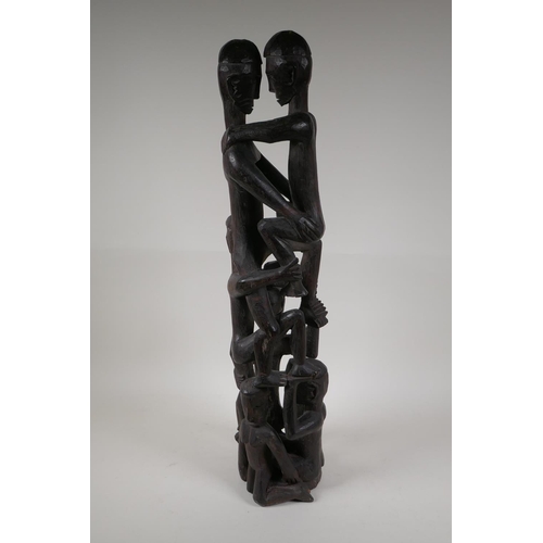 21 - A Philippino Ifugao carved hardwood figure group, 26