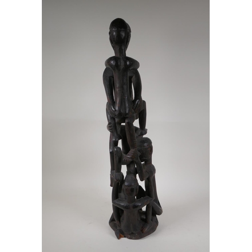 21 - A Philippino Ifugao carved hardwood figure group, 26