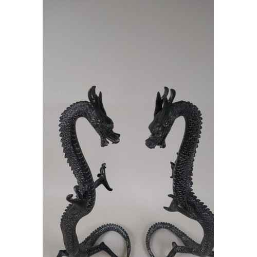 22 - A pair of Chinese bronze figures of dragons, 16