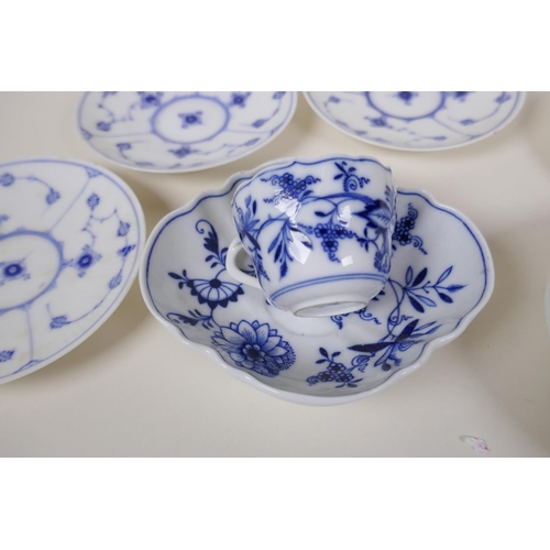 24 - A Meissen onion pattern blue and white porcelain petal shaped cup and saucer, AF, an early Copenhage... 