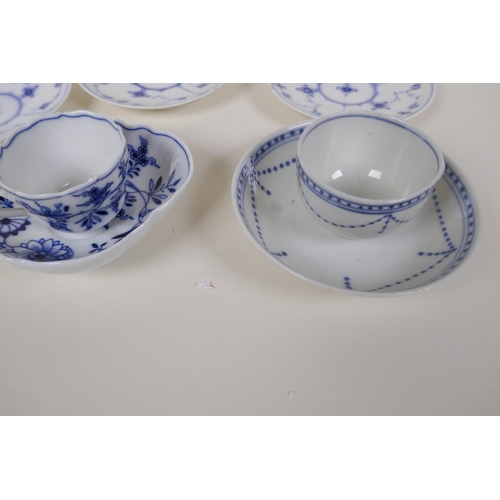 24 - A Meissen onion pattern blue and white porcelain petal shaped cup and saucer, AF, an early Copenhage... 