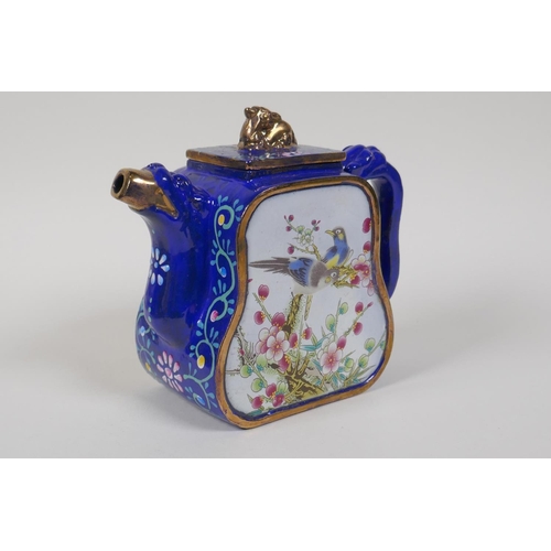 25 - A Chinese blue and gilt enamelled Yixing teapot, with famille rose decorative panels depicting birds... 