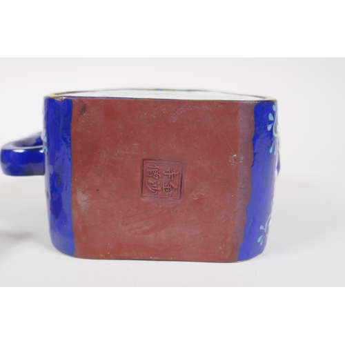 25 - A Chinese blue and gilt enamelled Yixing teapot, with famille rose decorative panels depicting birds... 