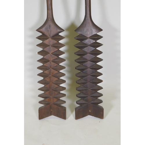 26 - A pair of Samoan carved wood tribal paddles, 55