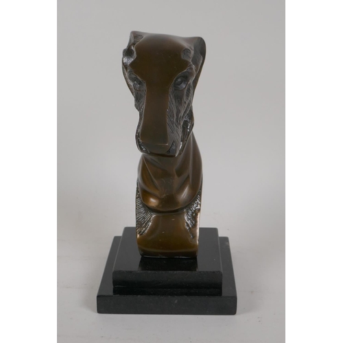 3 - A bronze bust of a greyhound on a stepped marble plinth, 8½