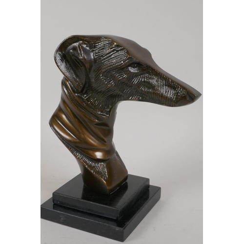 3 - A bronze bust of a greyhound on a stepped marble plinth, 8½