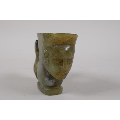 32 - A Chinese mottled green jade rhyton with carved mask and kylin decoration, 4