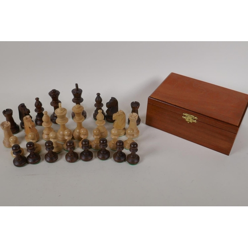 37 - A turned wood chess set, kings 3½