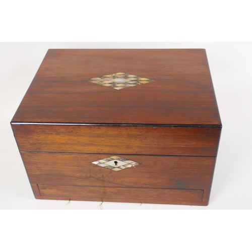 4 - A C19th rosewood vanity box with shell inlaid cartouche and key plate, with fitted interior and secr... 