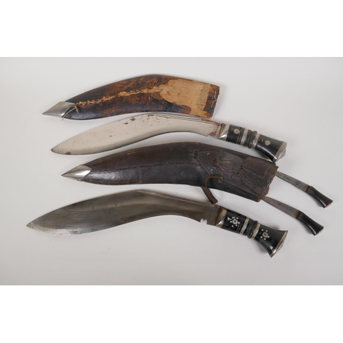 46 - Two vintage Kukri in wood and leather sheath, one complete with sharpeners, 16