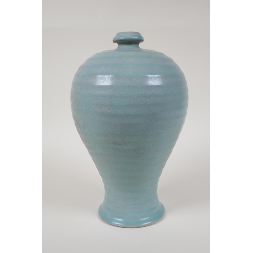 48 - A Chinese Ru ware style ribbed porcelain vase, chased character inscription to base, 10