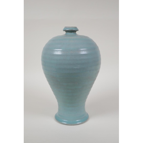 48 - A Chinese Ru ware style ribbed porcelain vase, chased character inscription to base, 10