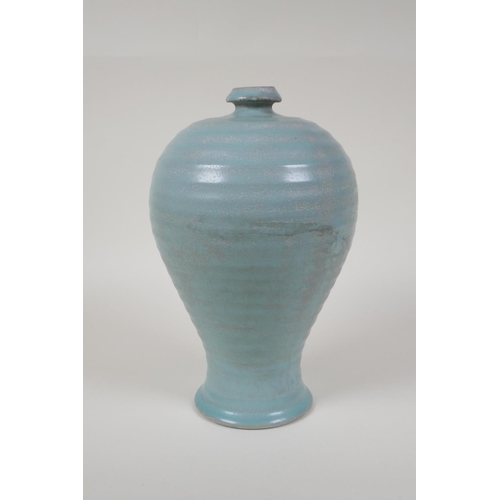 48 - A Chinese Ru ware style ribbed porcelain vase, chased character inscription to base, 10