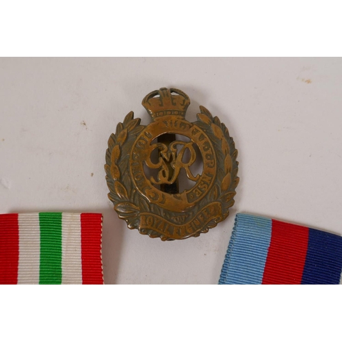 52 - A collection of WWII medals and ribbons, and a Royal Engineers cap badge