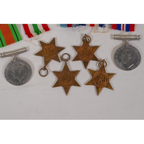 52 - A collection of WWII medals and ribbons, and a Royal Engineers cap badge