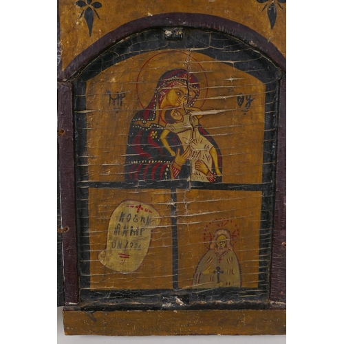 54 - An antique coptic triptych icon, 19½