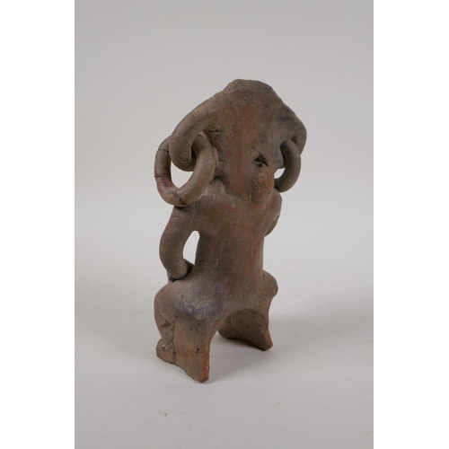 56 - A pre-Columbian painted terracotta figure, 7