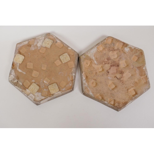 57 - A pair of Persian hexagonal stoneware tiles painted with geometric patterns, 7