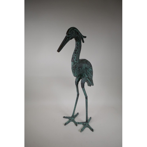 7 - A patinated garden figure of a heron, 27½