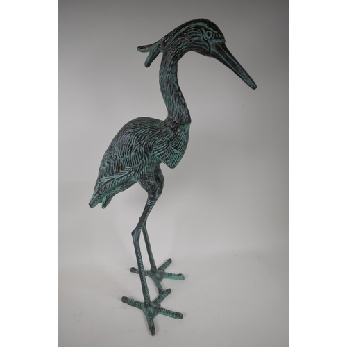 7 - A patinated garden figure of a heron, 27½