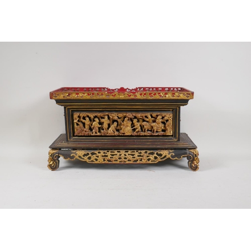 1 - An antique Chinese carved and pierced, gilt and lacquer wood stand decorated with industrious figure... 