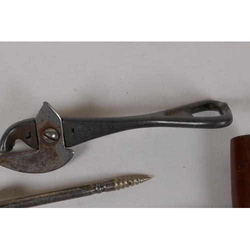 11 - Two antique cork screws, a 'Bully Beef' tin opener and a Champagne tap