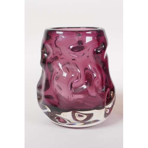 12 - An amethyst studio glass vase and a similar cranberry studio glass vase, largest 7½