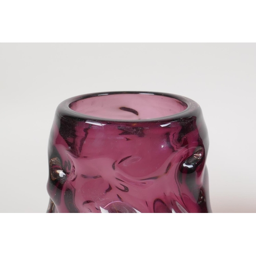 12 - An amethyst studio glass vase and a similar cranberry studio glass vase, largest 7½